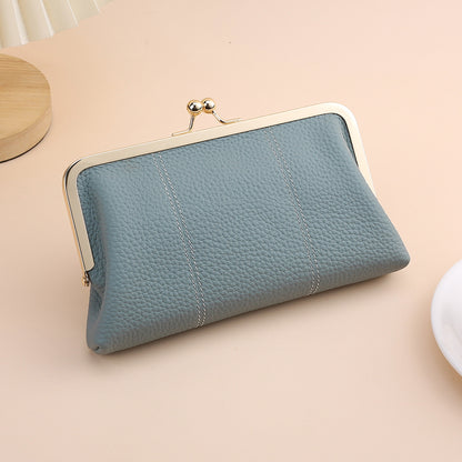 Blue cowhide clutch with polished metal frame