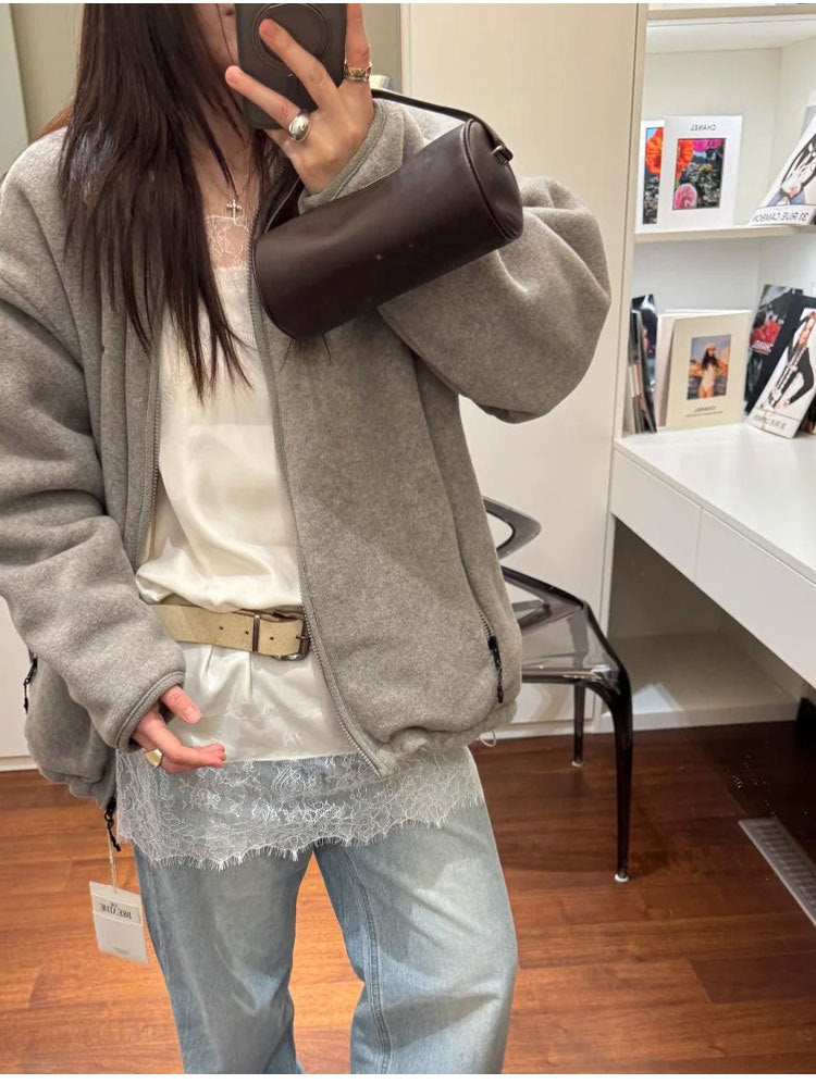 Close-up view of the dark brown bag worn over the shoulder