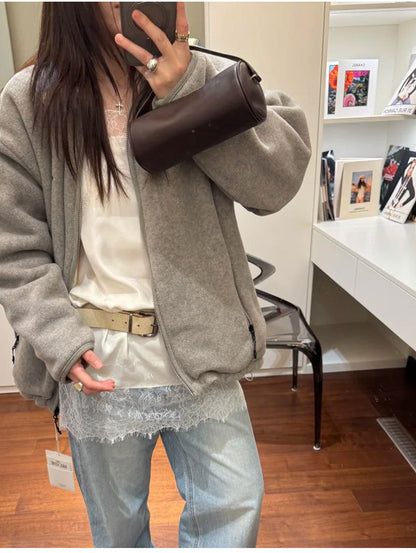 Close-up view of the dark brown bag worn over the shoulder