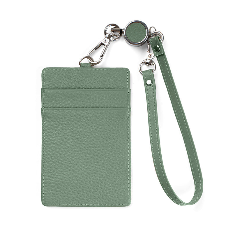 Jade green leather badge holder with retractable reel strap on white background