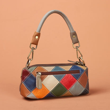 Geometric patchwork back of shoulder bag shown in use