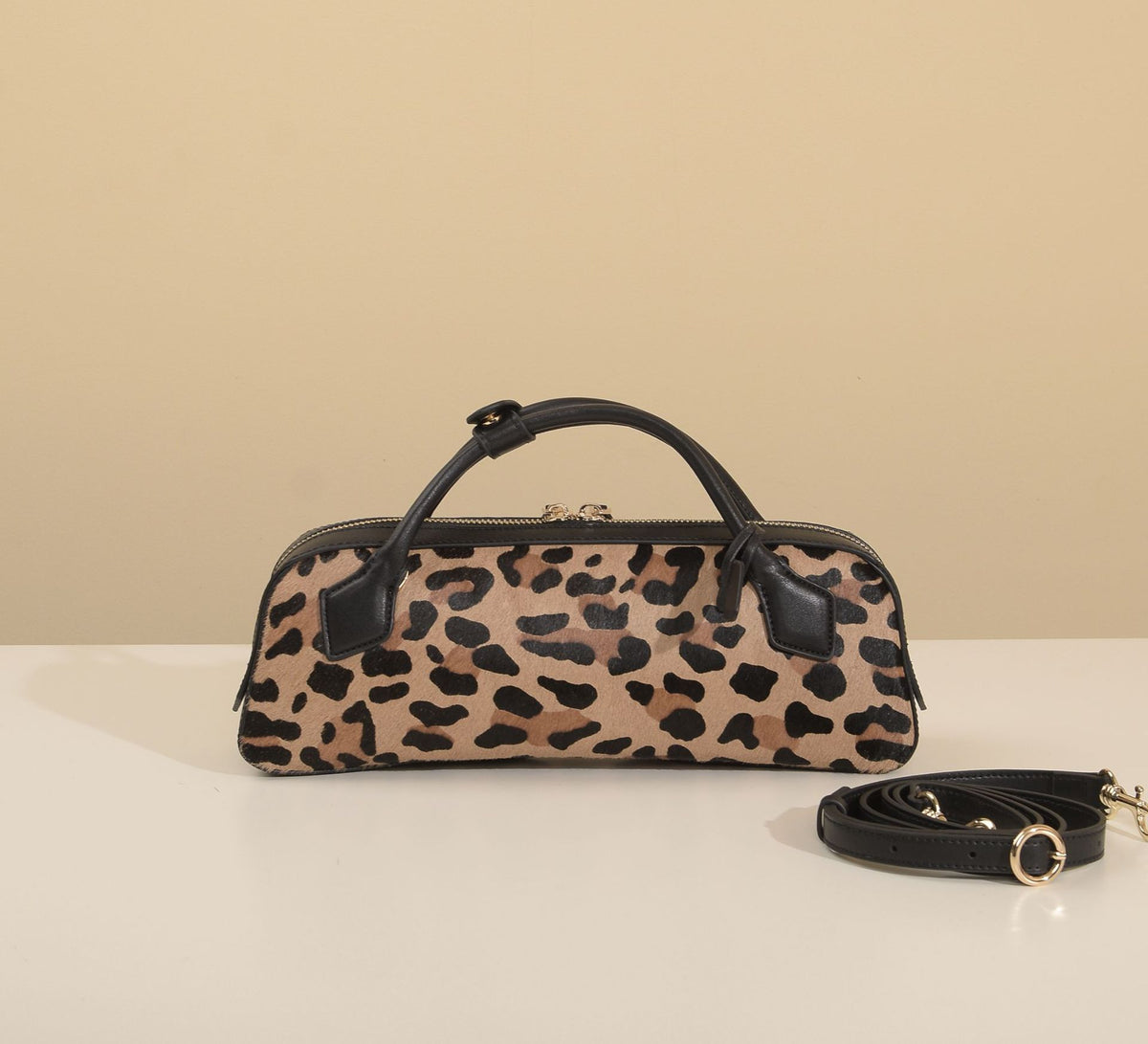 Close view of the bag's front panel and arched top handles