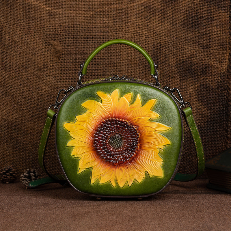 Vintage green sunflower crossbody bag with a rounded silhouette