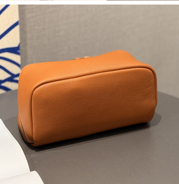 Sky blue leather cosmetic pouch with zip closure
