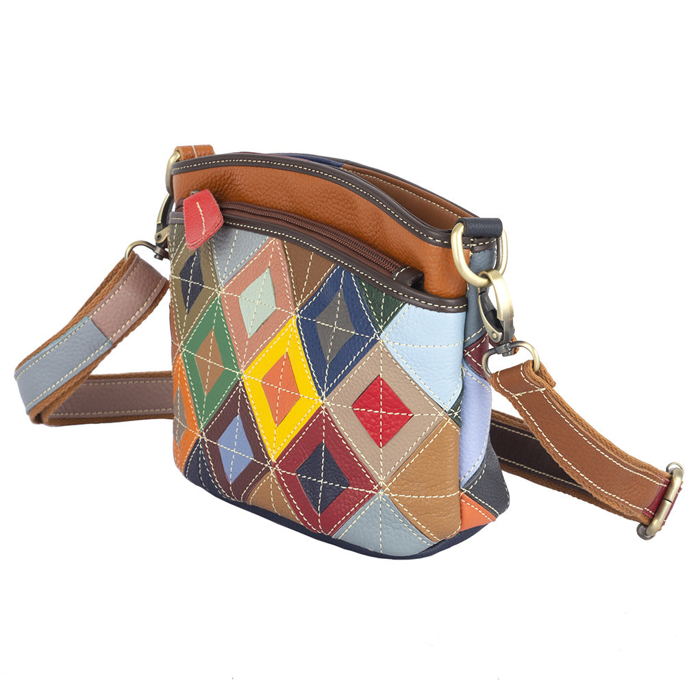 Angled view showing the patchwork side and shoulder strap