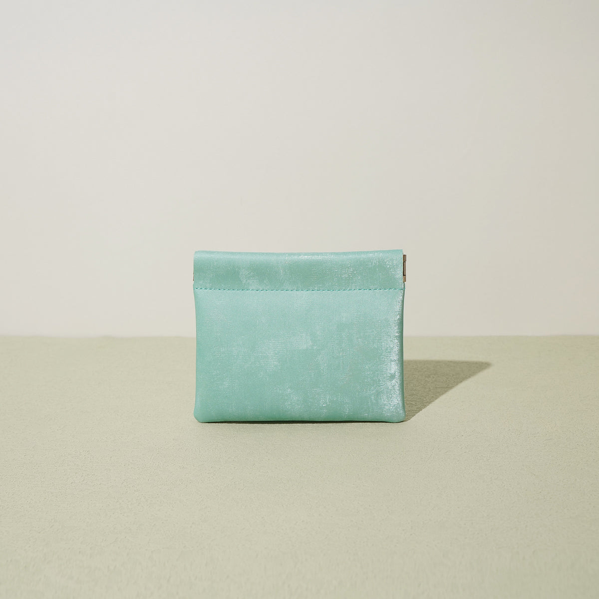 Sky aqua satin leather mini card pouch with visible spring clasp