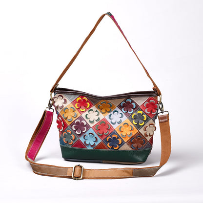 Front view of multicolor cowhide crossbody bag with raised flower patchwork