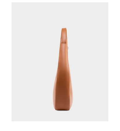 Side profile showing the depth of the crescent leather bag