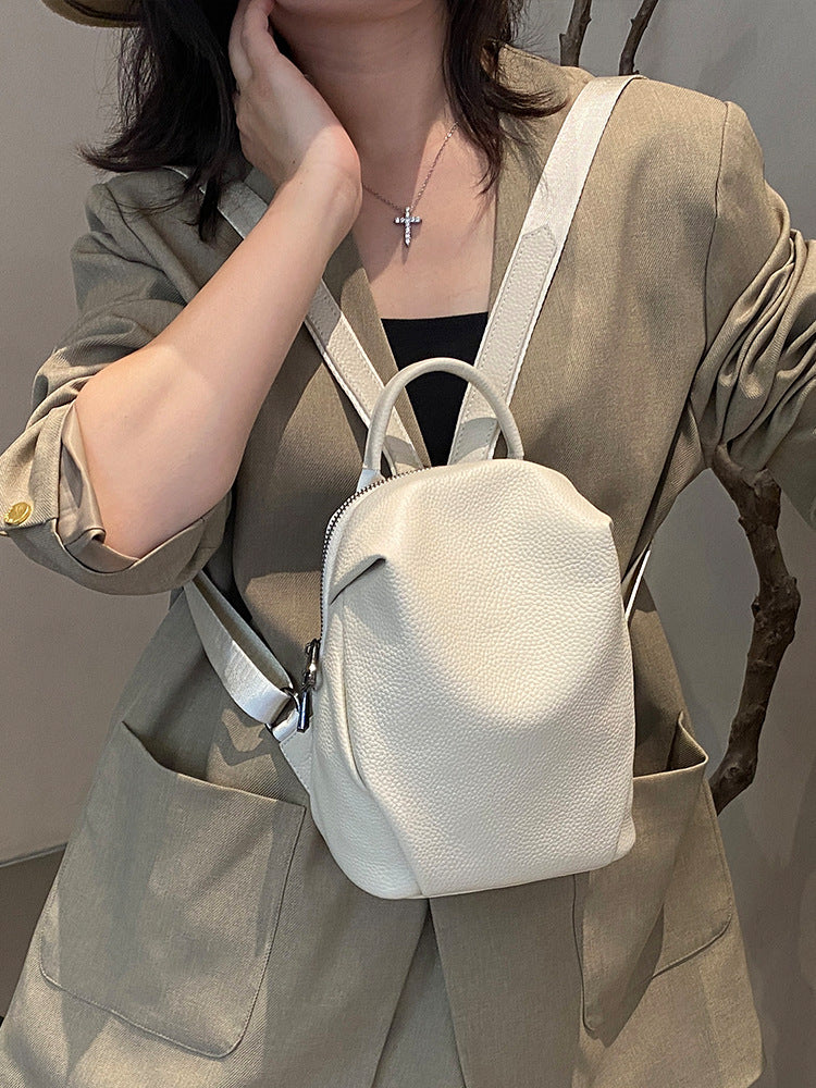 Close-up of the off-white mini backpack and zip closure