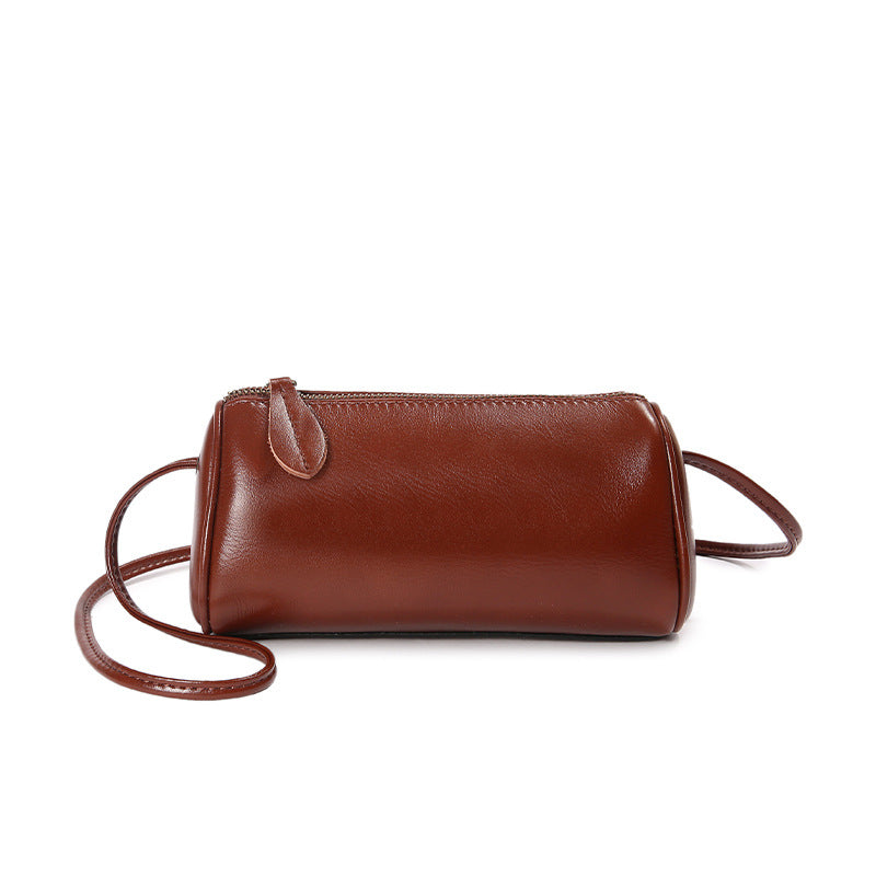 Caramel brown top-grain cowhide mini barrel crossbody bag front view