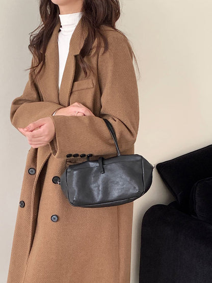 Black soft-structured bag shown from the front
