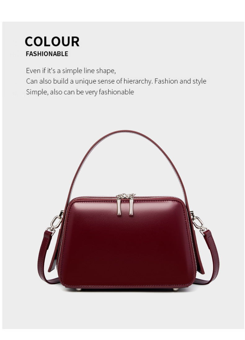 Wine red leather crossbody bag displayed with color and styling graphic