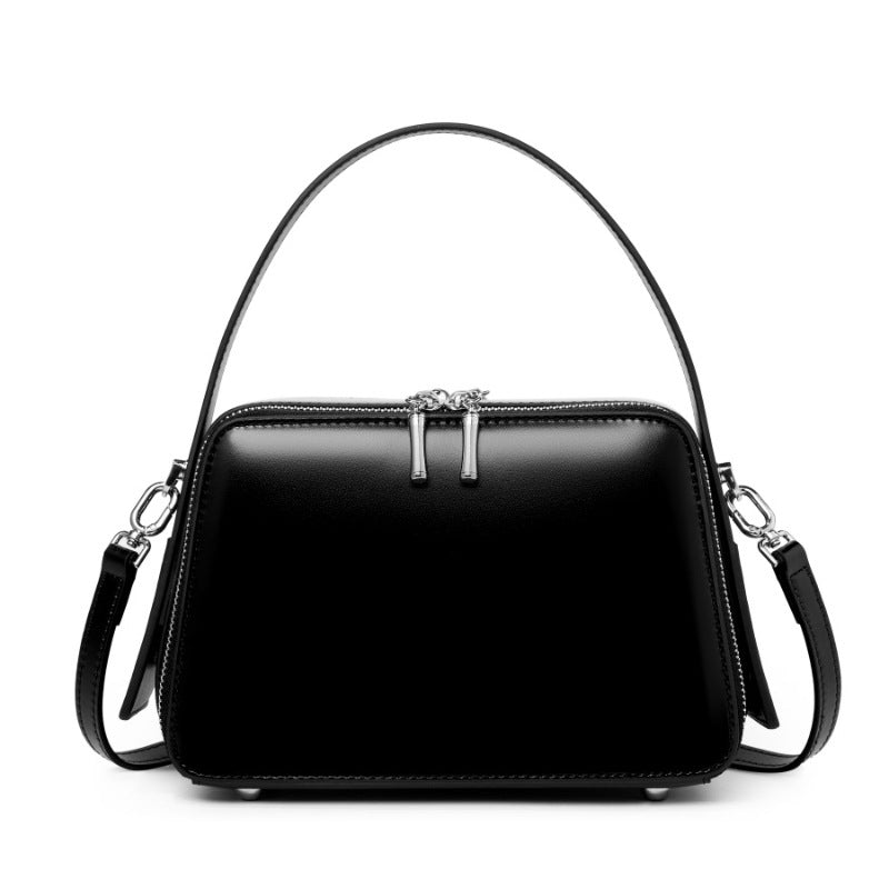Black cowhide leather small crossbody bag with top handle and dual zip closure