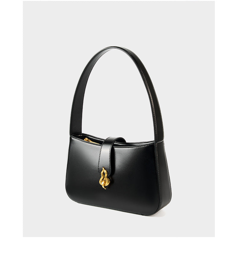 Side view of black leather shoulder bag showing flap and gourd clasp
