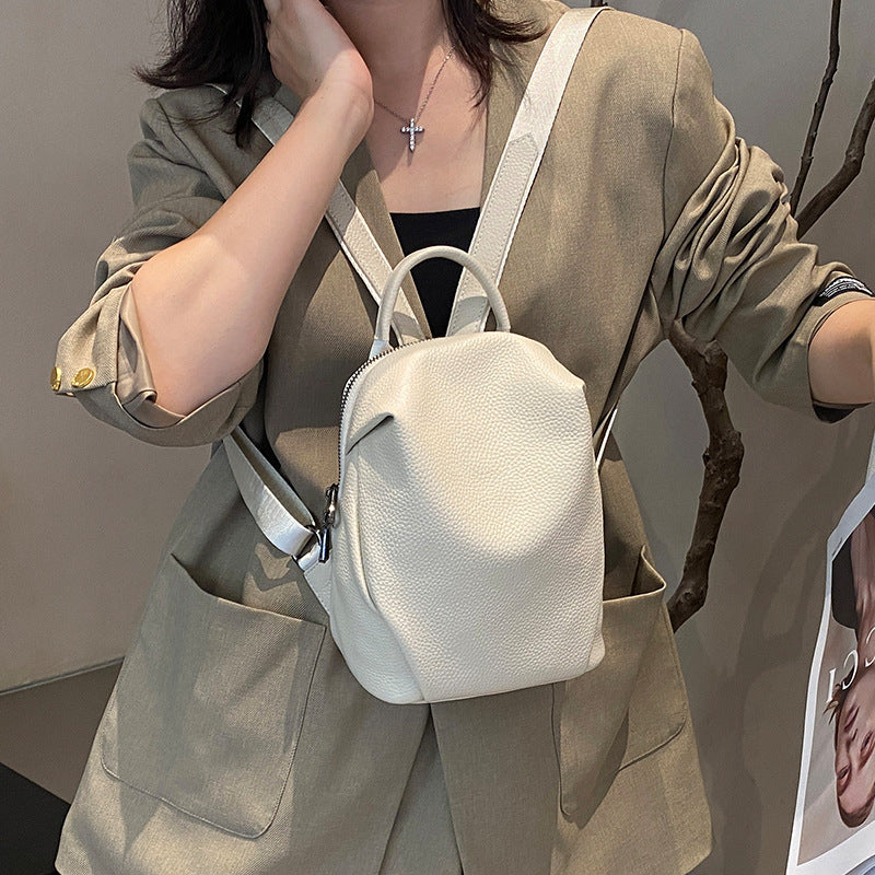 Off-white pebbled leather mini backpack shown from the front