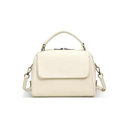 Cream white soft leather Boston bag with top handle and shoulder strap