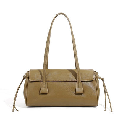 Olive green cowhide leather shoulder bag with top handles on white background