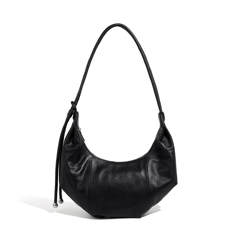 Top-grain cowhide crescent hobo bag with adjustable shoulder strap on white background