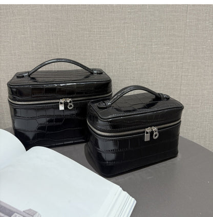 Black leather cosmetic pouches with silver zipper hardware