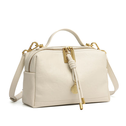 Off-white cowhide leather small handbag with top handle and adjustable strap