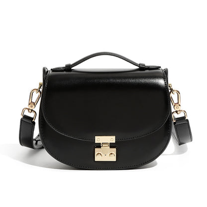 Black cowhide leather mini saddle crossbody bag front view