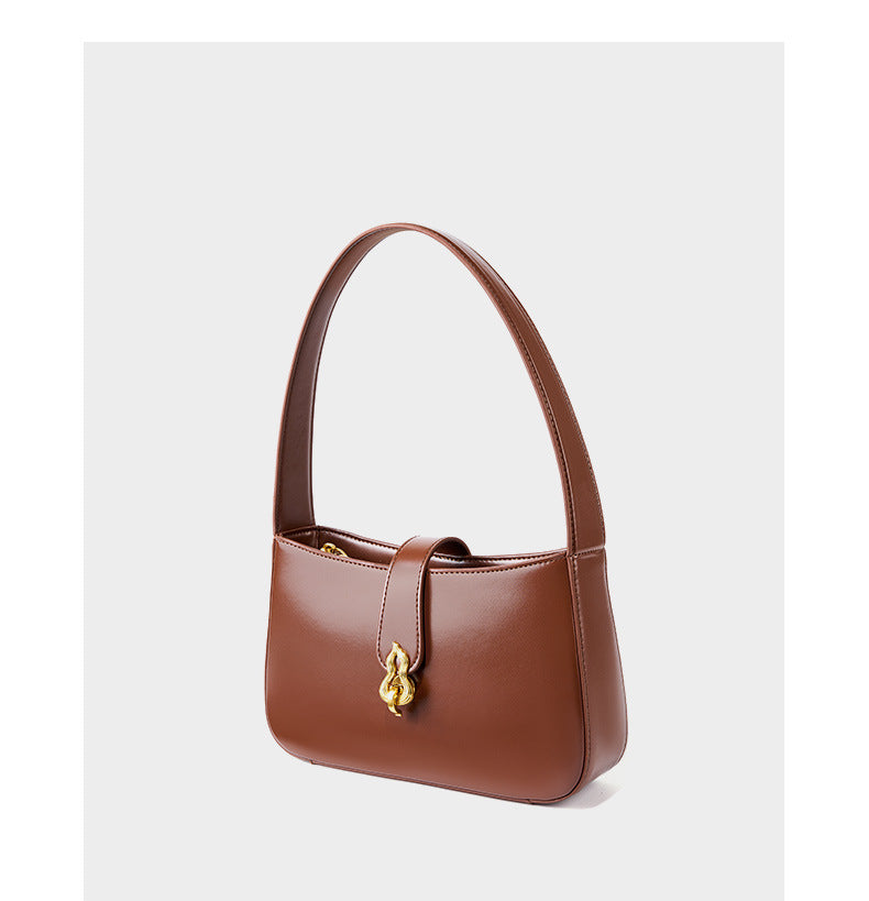 Side view of coffee brown leather shoulder bag showing structured silhouette