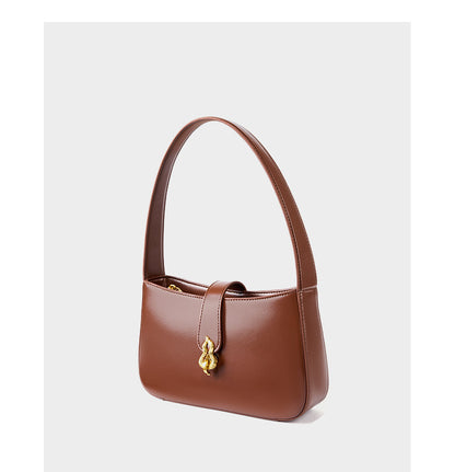 Side view of coffee brown leather shoulder bag showing structured silhouette