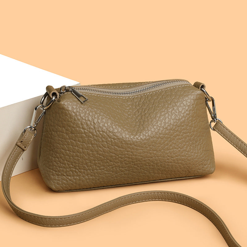 Khaki pillow-shaped leather shoulder bag shown from the front