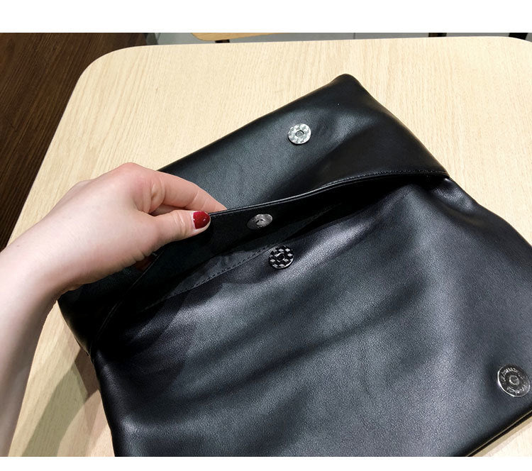 Open clutch showing magnetic closure hardware under the flap