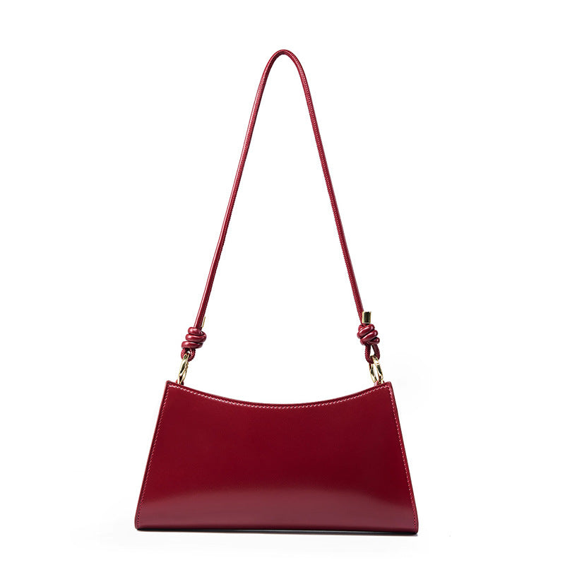 Wine red cowhide leather shoulder bag with gold-tone hardware accents