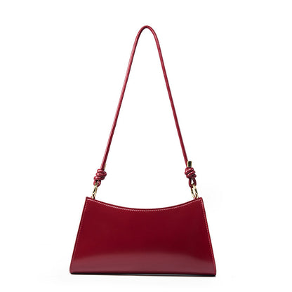 Wine red cowhide leather shoulder bag with gold-tone hardware accents