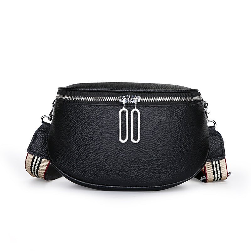 Black pebbled cowhide saddle crossbody bag with striped strap
