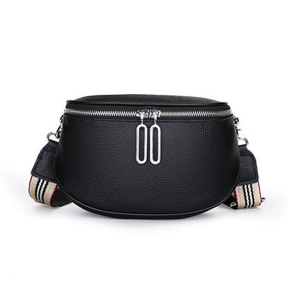 Black pebbled cowhide saddle crossbody bag with striped strap