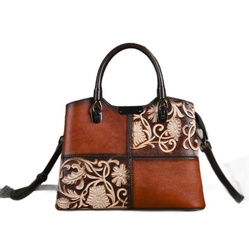 Front view of a rectangular brown leather patchwork bag with top handles and shoulder strap