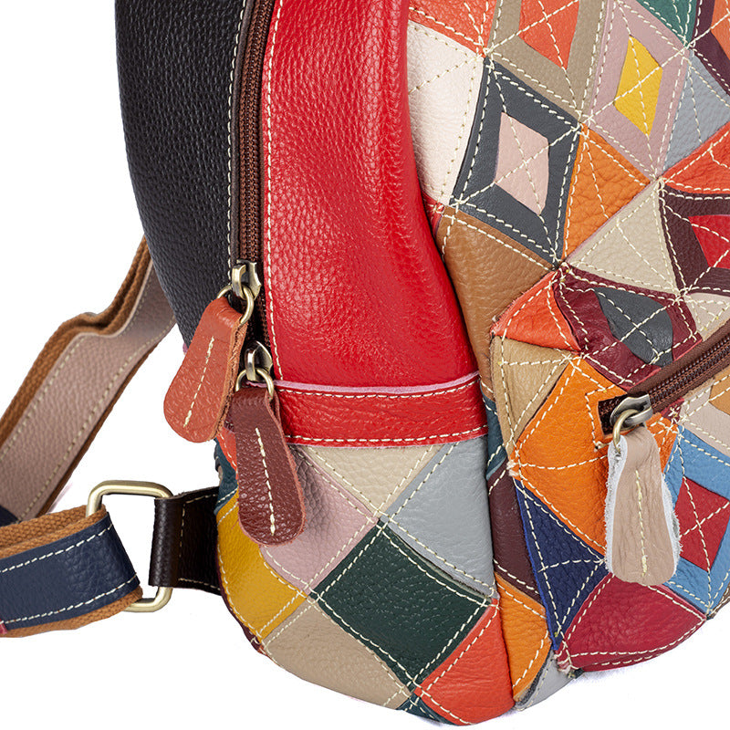 Close-up of leather color-block panels and zipper pulls