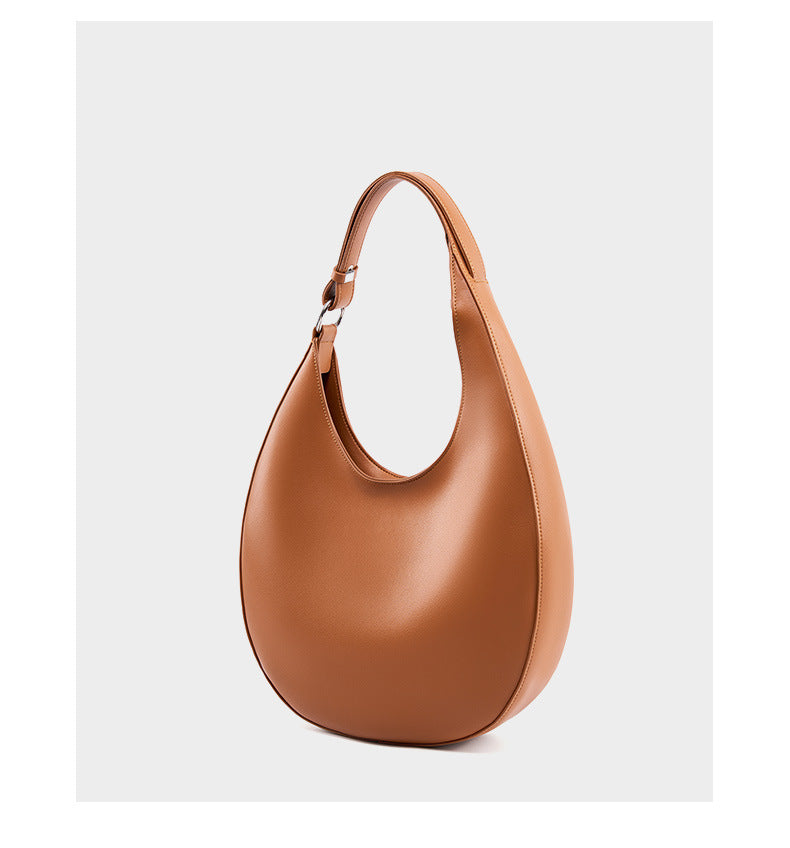 Front view of the brown crescent shoulder bag