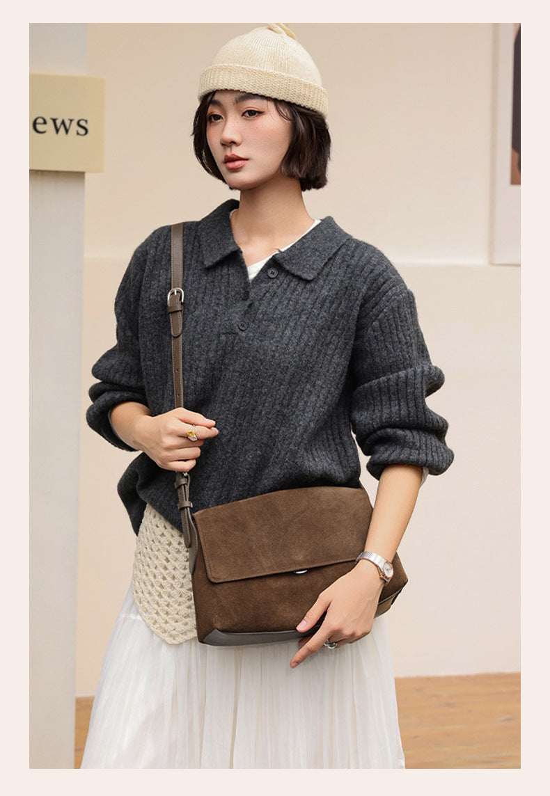 Back view of a caramel suede shoulder bag worn crossbody