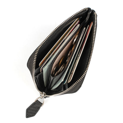 Black leather wallet filled with cards and folded bills demonstrating capacity