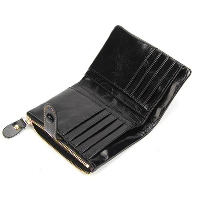 Open black cowhide leather wallet showing 12 card slots and zip coin pocket