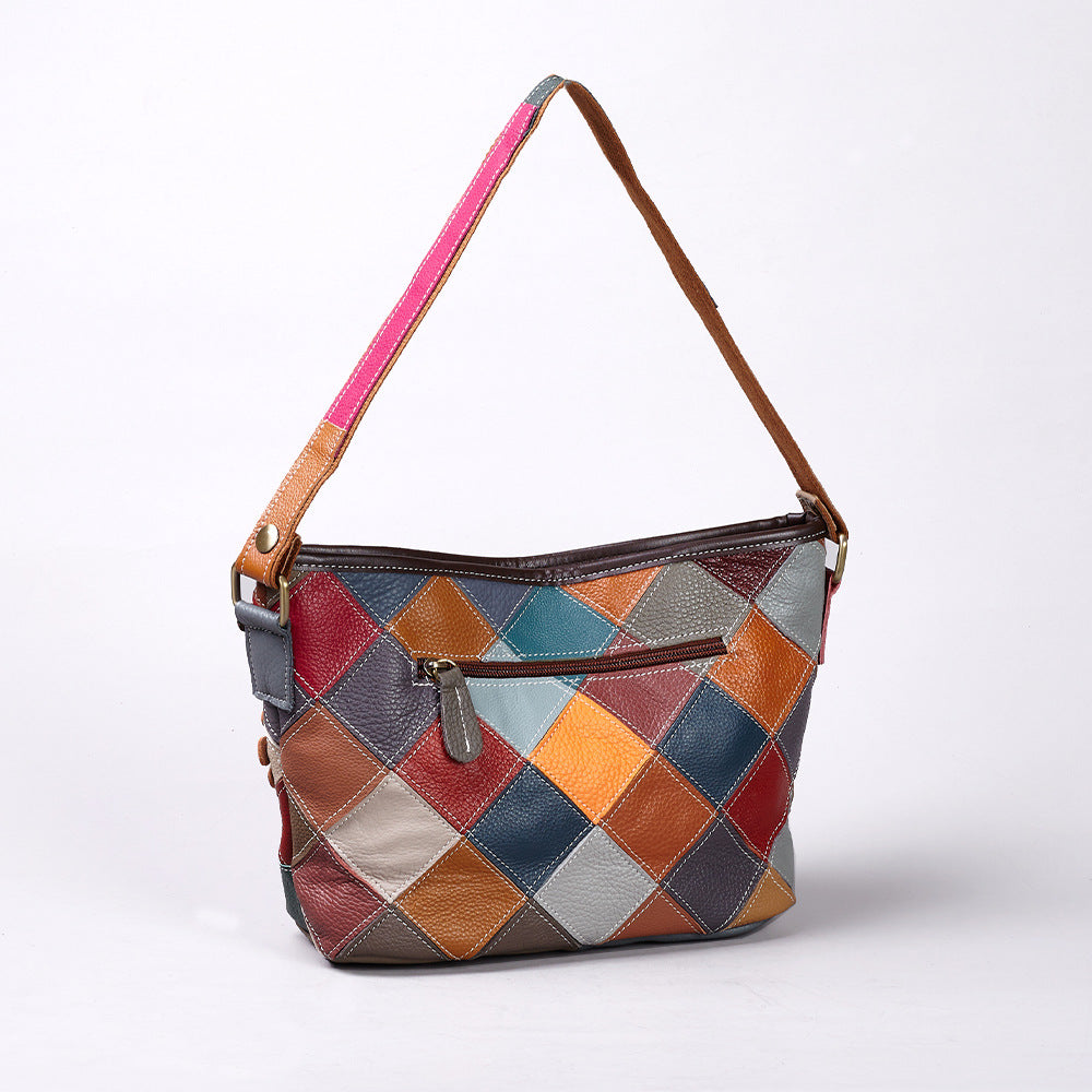 Back of the bag with geometric patchwork and exterior zip pocket