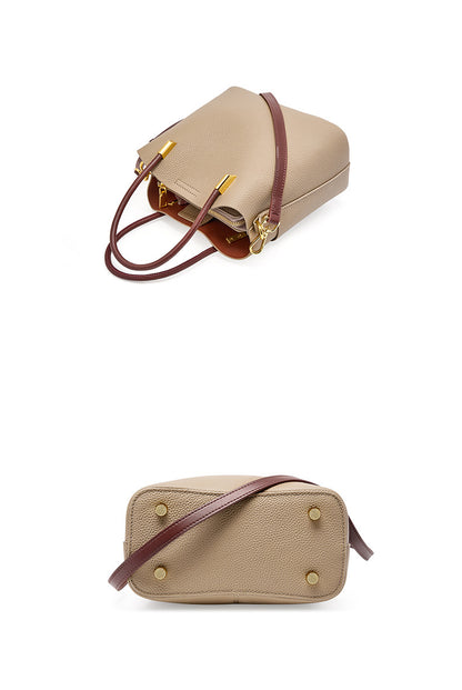 Gray bucket bag shown from the side and bottom angles to display feet and strap