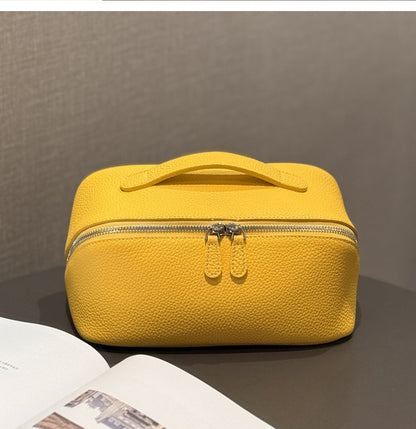 Yellow leather cosmetic pouch shown from the front