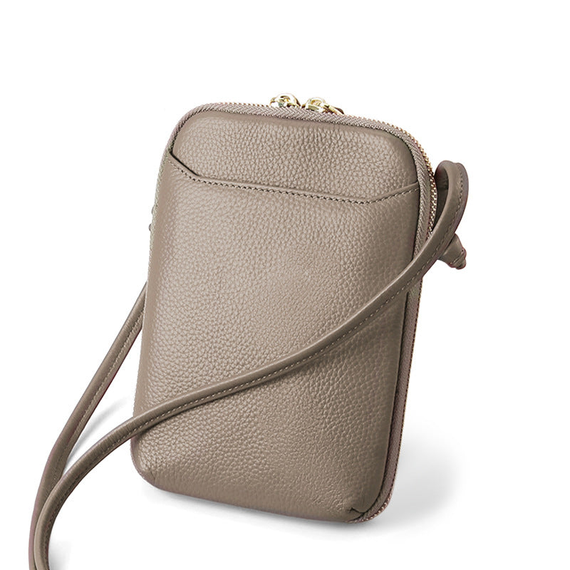 Dark khaki pebbled cowhide vertical crossbody phone bag with adjustable strap