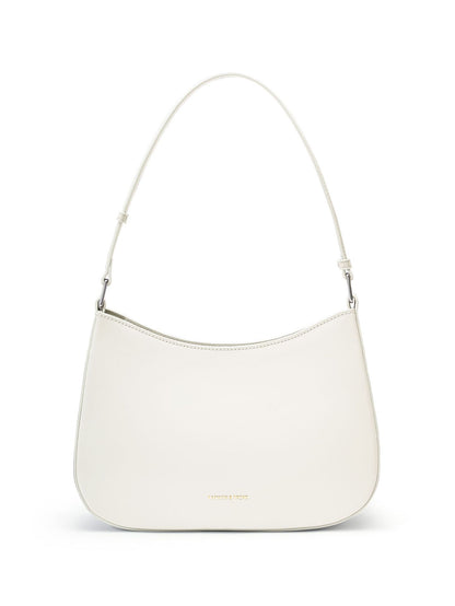 White cowhide leather underarm shoulder bag with magnetic snap closure on white background