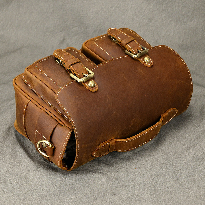 Angled view of the leather handle and front flap