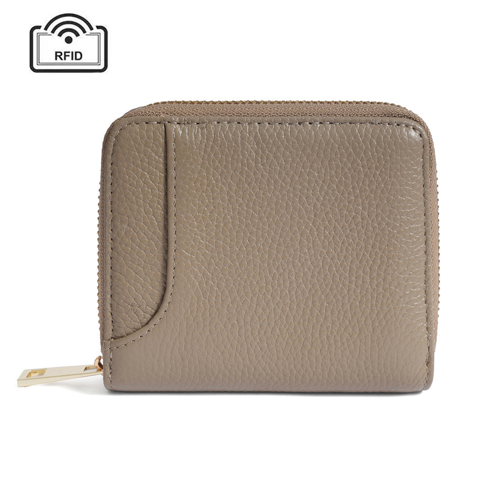 Taupe pebbled cowhide RFID zip-around wallet with gold-tone zipper, front view