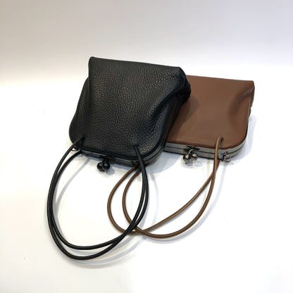 Black and coffee leather frame bags displayed together