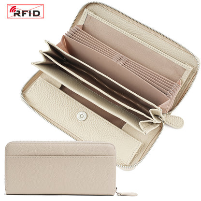 Open ivory wallet displaying card slots, bill compartments, and coin pocket
