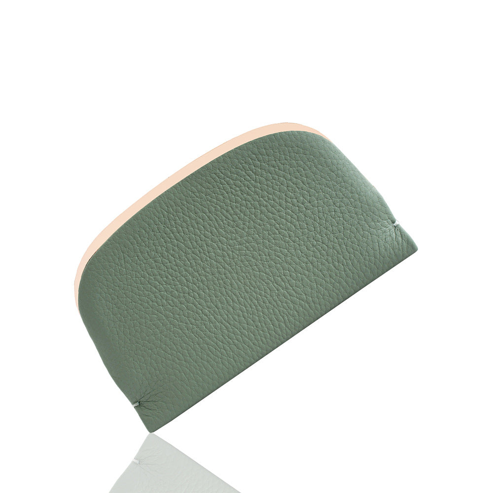 Green pebbled leather coin purse shown closed