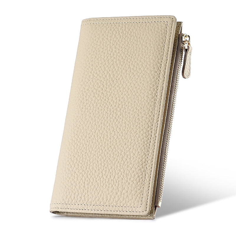 Standing view of the slim beige two-fold wallet and zipper